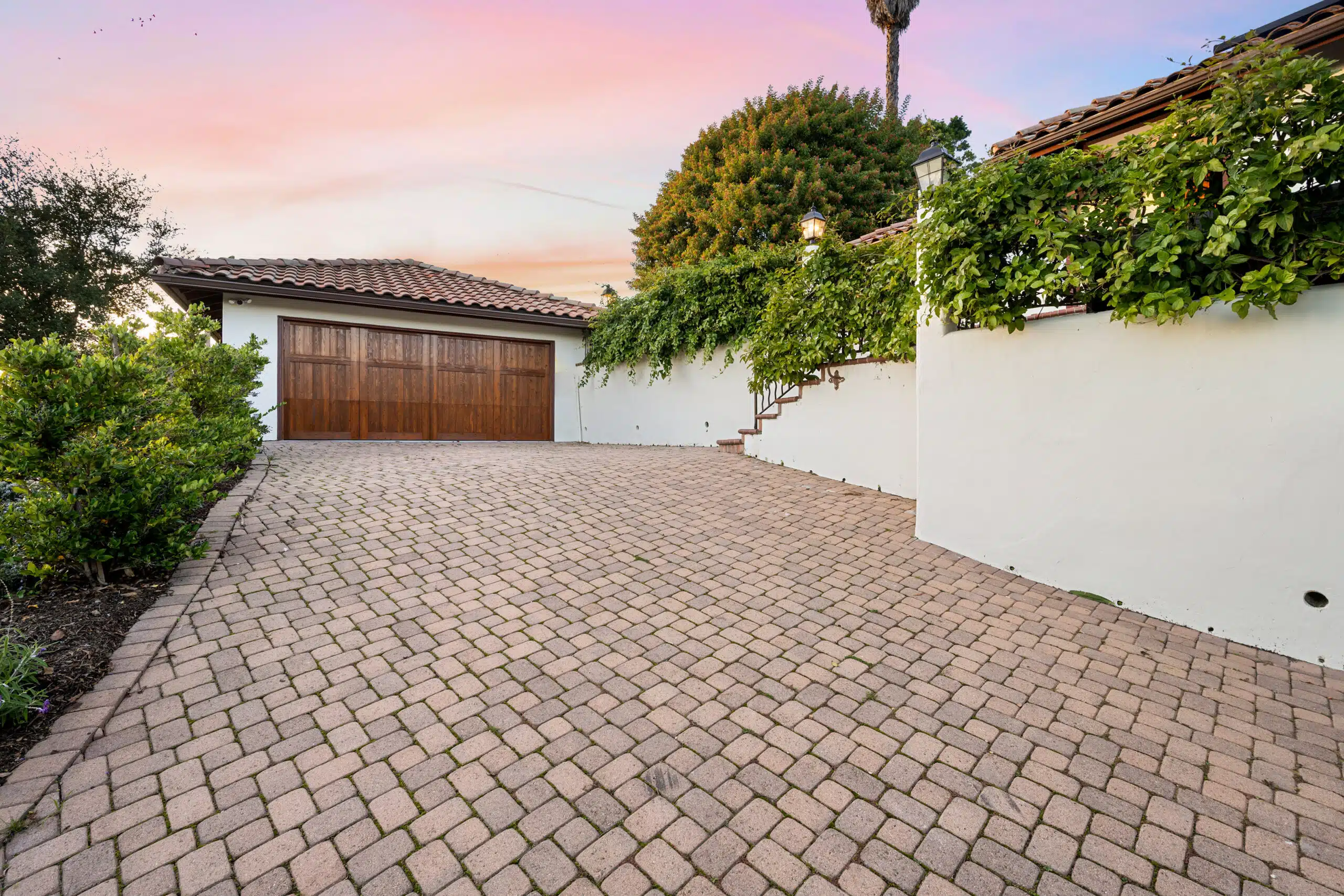 a driveway with brick pavers and a garage in the 2025 02 03 05 53 53 utc scaled